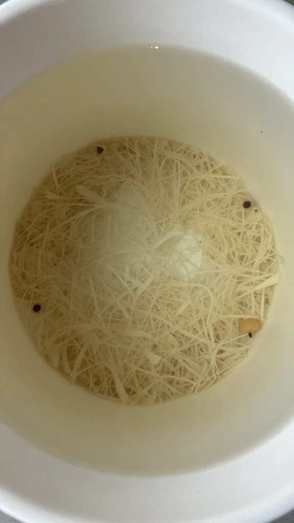 Closeup of shallow clear-underbed bin with visible contents